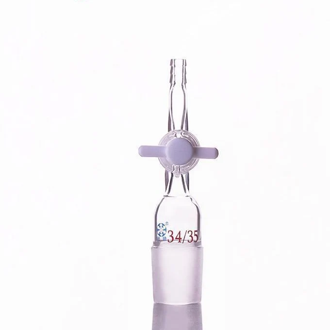 Adattatore di collegamento con raccordo per tubo flessibile e rubinetto di chiusura in PTFE